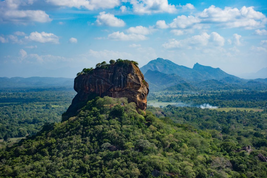 Sigiriya, also known as Lion Rock, is a 5th-century ancient rock fortress and palace above the surrounding plains in the Central Province of Sri Lanka.