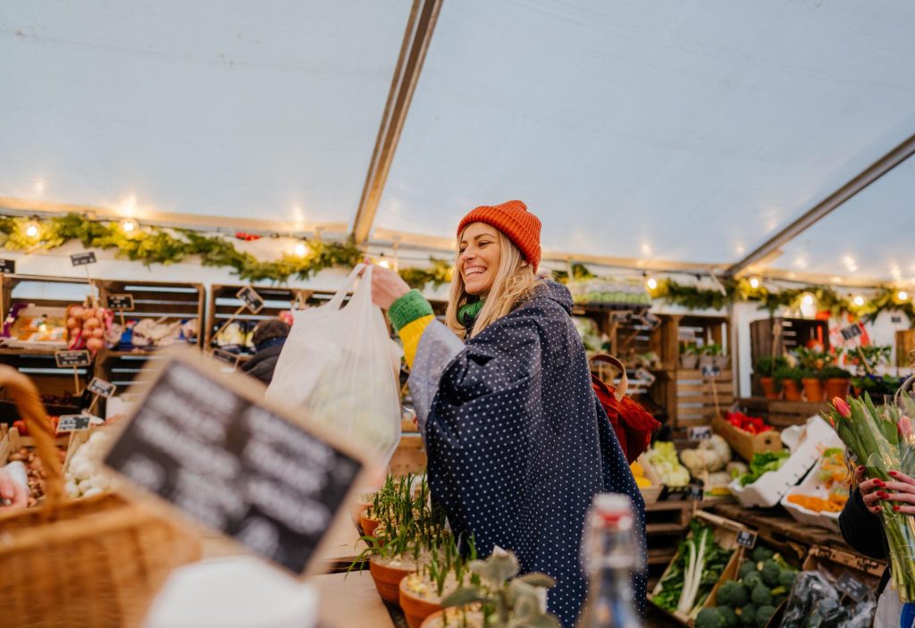 smiling woman in outdoor food market