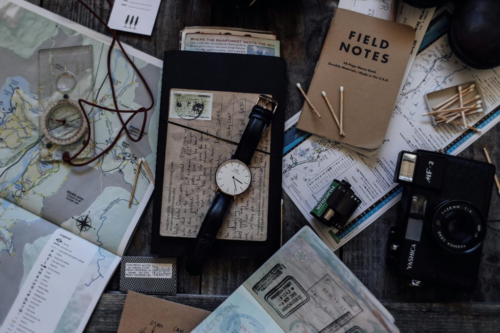 travel itinerary field testing preparation with notes and equipment