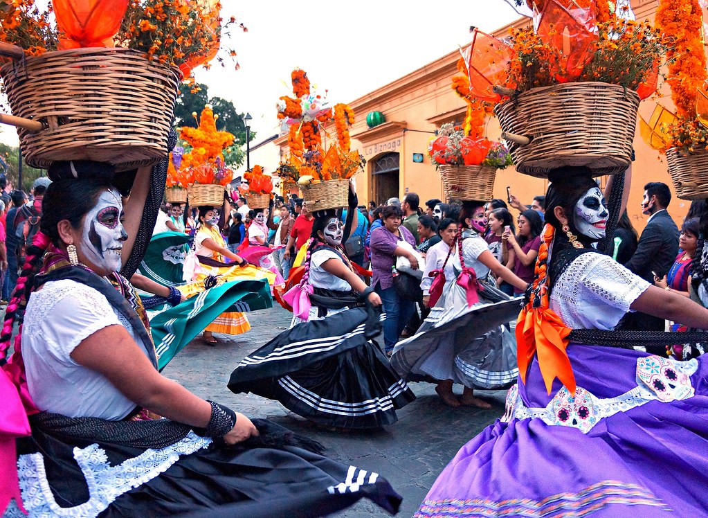 The locals of Oaxaca parading in the street on Dia de los Muertos